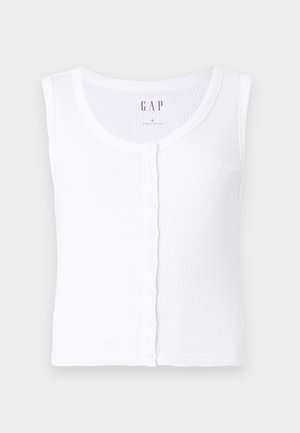 Hvit rillede tank topp med rund hals, med front knappelukking. Stoffet er mykt med en glatt tekstur. Merke: GAP. Størrelse: S.