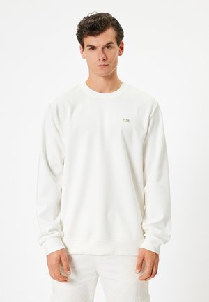 Hvid sweatshirt med lange ærmer, rund hals og teksten "ESSN." broderet i brun på brystet. Glat bomuldsstof.