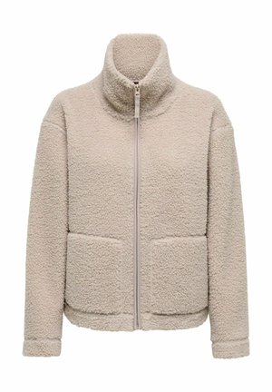 Zachte beige zip-up jack met hoge kraag, voorzien van twee voorzakken en een gestructureerde stof. Eenvoudig ontwerp met een zachte, gezellige uitstraling.