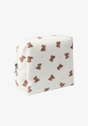 Lukked kosmetisk pung lavet af blød stof med en cremefarvet baggrund prydet med spredte brune teddy bjørne-illustrationer og små blå stjerner.