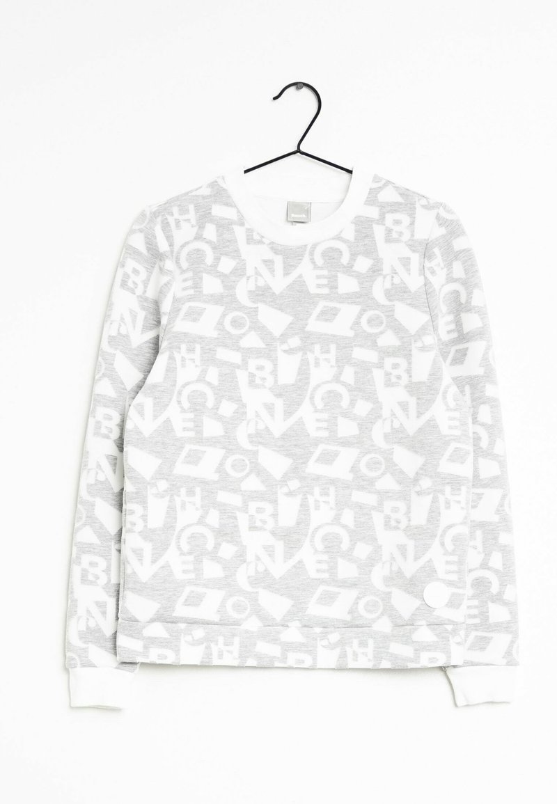 Grey sweatshirt with a white geometric pattern. Features a round neckline and ribbed cuffs. Material appears soft and textured.