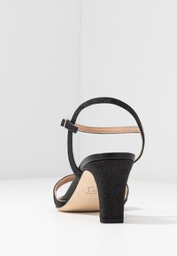Unisa Korolliset sandaalit - black
