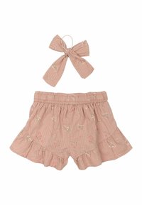 Rosa bomullsshorts med volangkant, med blommönster i vitt och grönt. Inkluderar en matchande håraccessoar med rosett.