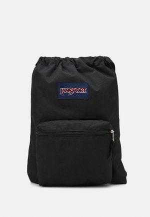 Black backpack made of durable fabric with a cinched top. Features a front zippered pocket and a blue and red Jansport logo patch.