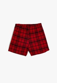 Shorts à carreaux rouges en tissu doux, avec un motif à damier noir, une taille élastique et une coupe décontractée.