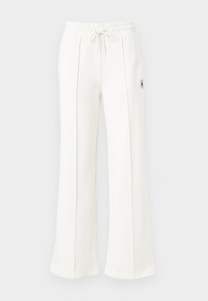 White wide-leg sweatpants featuring an elastic waistband with a drawstring and a small embroidered logo on one side. Soft fabric texture.