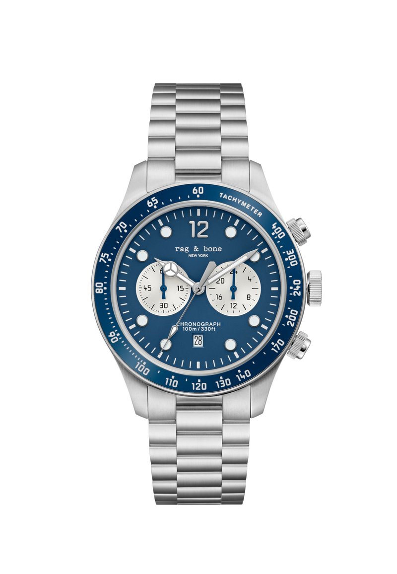 Roostevabast terasest kronograafkell sinise kellanäidiku, valgete aladialkide, hõbedaste aktsentide ja lingiga rihmaga. Veekindel kuni 100 m.