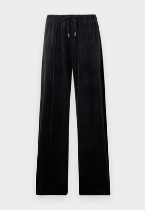 Pantaloni velour neri a gamba larga con waistband elastico e laccio regolabile, dettagli della cucitura verticale visibili sul davanti.