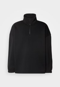 Felpa con zip nera realizzata in tessuto morbido. Presenta un colletto alto, maniche lunghe con polsini elastici e una vestibilità rilassata.