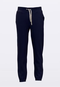 Marineblaue Jogginghosen mit beigem Kordelzug, elastischem Bund, Seitentaschen und Bündchen an den Knöcheln vor einfachem Hintergrund.