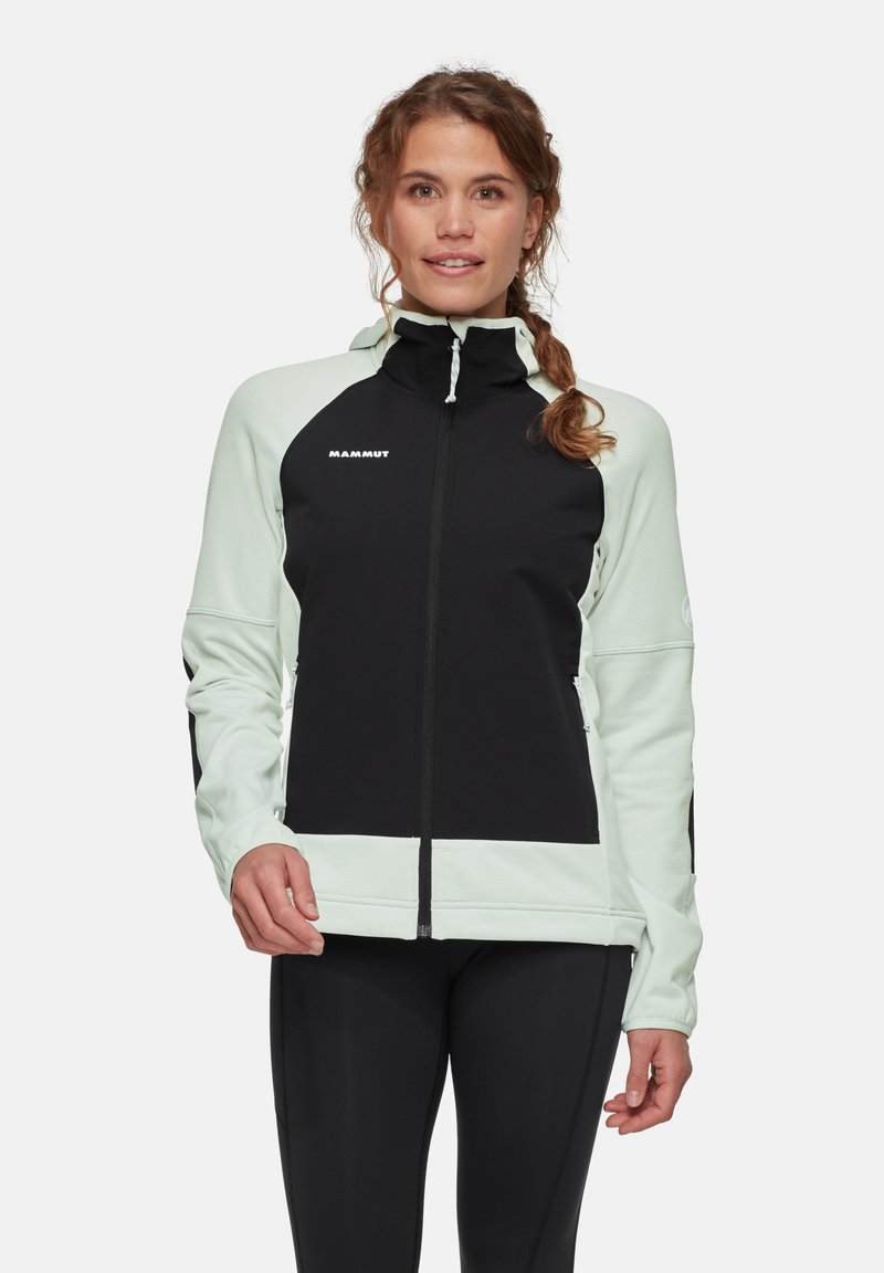 Zwarte en muntgroene ritsjacket met een staande kraag, voorzien van textuurstof, ritszakken en het Mammut-logo op de borst.