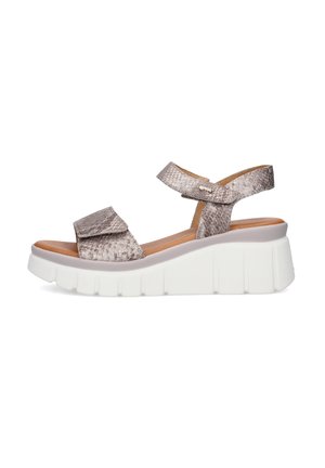 Sandalo con zeppa beige con motivo effetto pelle di serpente, cinturini regolabili alla caviglia e alle dita, suola bianca spessa.