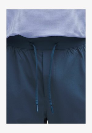 Pantaloni atletici blu naval con vita regolabile tramite cordino. Tessuto morbido e liscio con una leggera lucentezza. Presentano una vita arricciata per maggiore comfort.