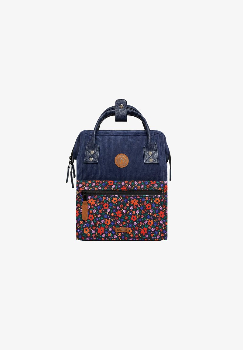 Navy corduroy backpack with floral pattern in red, pink, and purple. Features a top handle, front zipper pocket, and leather accents.