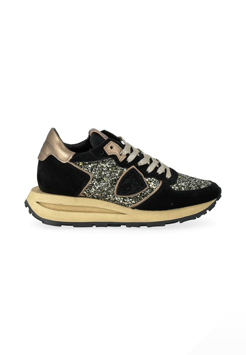Black sneaker featuring a glittery upper, suede accents, goldtone heel tab, cream laces, and a thick beige midsole with a black outsole.