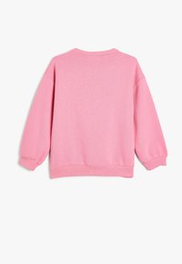 Roze katoenen sweatshirt met een ronde hals, verlaagde schouders en ribgebreide manchetten en zoom. Soepele textuur met een effen kleur.