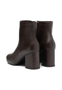 Brown leather ankle boots with a smooth finish, rounded toe, and sturdy block heels. Features a side zipper for easy wear.