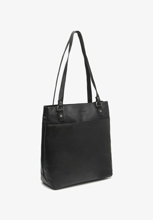 Sac en cuir noir avec deux longues poignées, doté d'un panneau de poche avant lisse, se tenant debout sur un fond blanc.