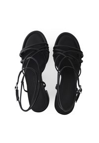 Schwarze Sandalen mit schmalen, überkreuzten Riemen, offener Zehenpartie und einem Schnallenverschluss am Knöchel. Hergestellt aus glattem Material mit matter Oberfläche.