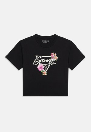 Schwarzes, kurzgeschnittenes T-Shirt mit weißem "Guess Los Angeles"-Schriftzug in einem Dreieck, verziert mit pinken und orangefarbenen tropischen Blumen.