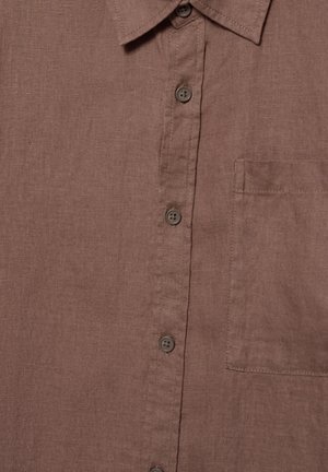 Barna len ing elölről, ahogy látható a gallér, négy gomb és egy jobb oldali mellzseb.