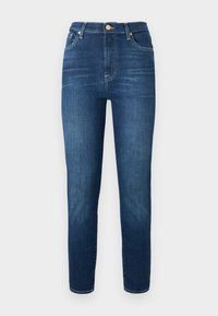 Mørkeblå denimjeans med høy midje, smale ben og knappestandard. Har subtil falming og ingen synlige mønstre eller dekorasjoner.