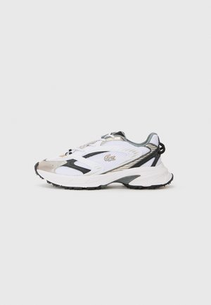 White athletic shoe with silver and black accents, mesh upper, textured sole, and a streamlined design featuring a logo on the side.