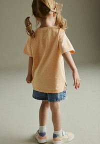 Next SHORT SLEEVE - REGULAR FIT - T-shirts print - orange cosmic graphic