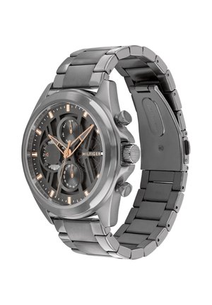 Stainless steel Tommy Hilfiger wristwatch with black dial, rose gold hour markers, three subdials, and a metal link bracelet.
