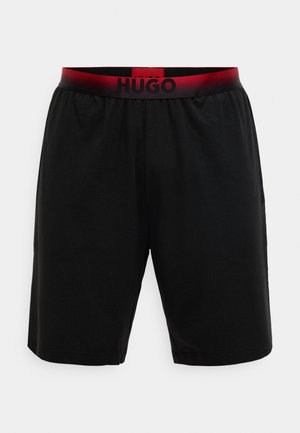 Juodi šortai iš minkštos medžiagos su elastinga juosmens juosta, kurioje yra raudonas gradientas ir juodas „HUGO“ ženklinimas. Paprastas, tiesaus kirpimo dizainas.