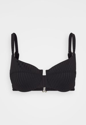 Black structured bra with vertical ribbed texture, underwire support, adjustable straps, and a gold-tone hook closure at the front.
