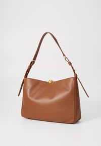 Brown leather handbag with a soft texture, a rounded shape, and a gold button closure. Features an adjustable shoulder strap.