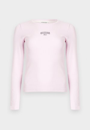 Long-sleeve pink ribbed shirt featuring a round neckline and "GUESS Jeans" embroidered logo in black at the chest. Soft texture, fitted design.
