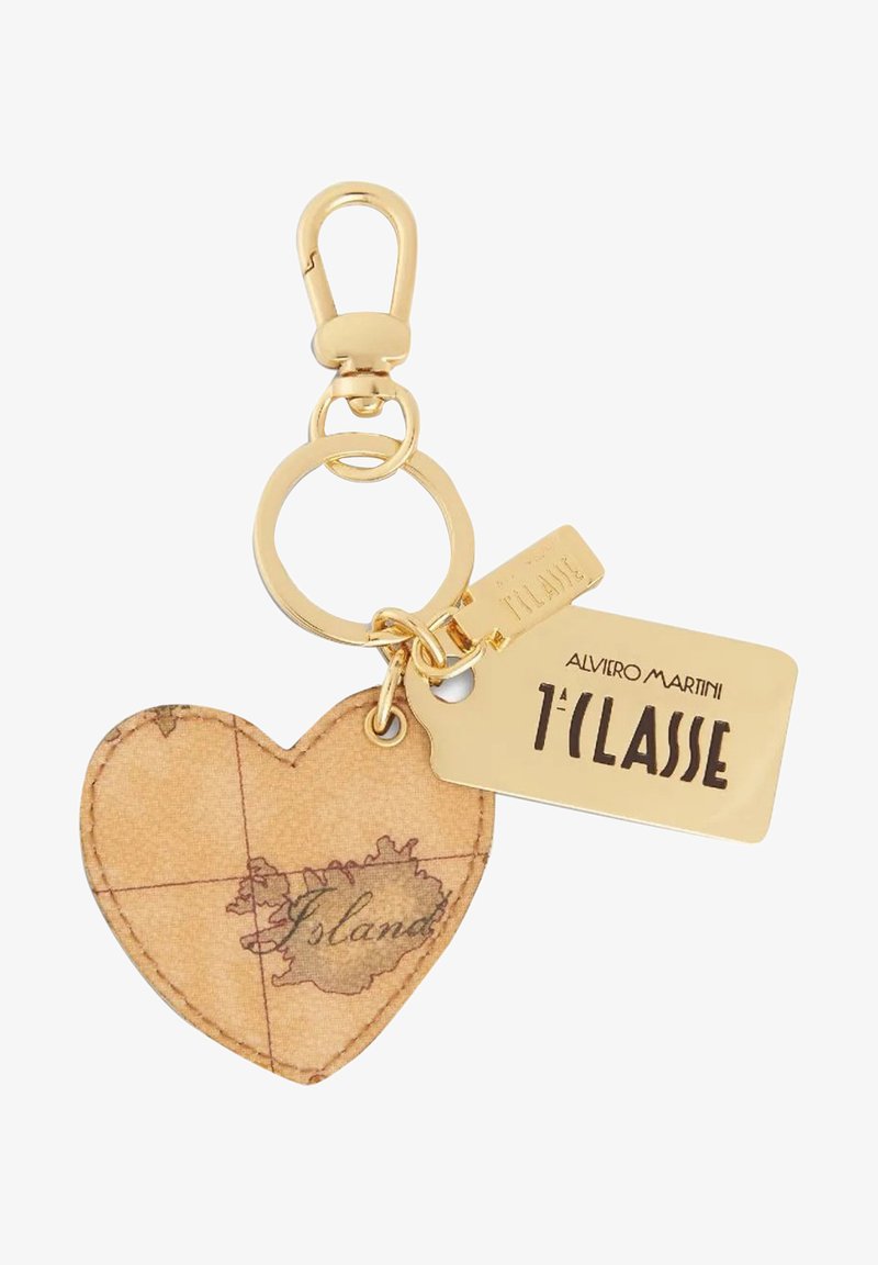 Portachiavi a forma di cuore realizzato in pelle beige con stampa della mappa. Gancio in metallo dorato e etichetta con il marchio "1ª CLASSE" attaccata.