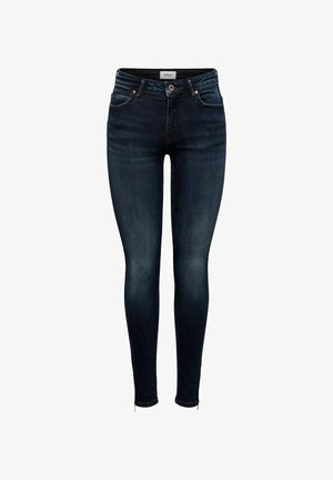 Tynne jeans laget av mørk denim med en svak glans, med fem lommer, bronseknapp og metalldetaljer ved anklene.