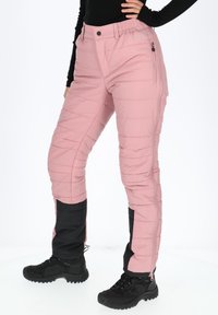 Roze geïsoleerde broek met geborduurd patroon, zijritsen en een zwarte onderkant. Voorzien van een elastische tailleband voor comfort.