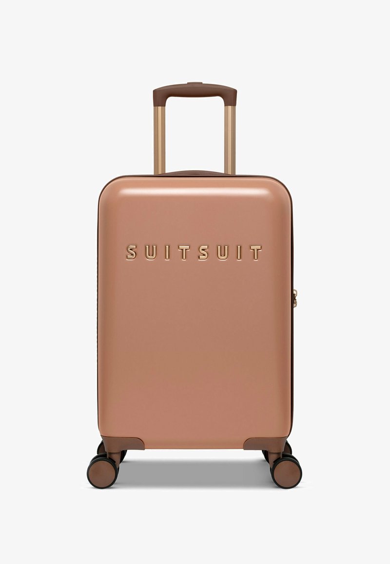 Hard-shell koffer in roségoud met een gladde afwerking, voorzien van een gouden logo, een uitschuifbare handvat en vier multidirectionele wielen.