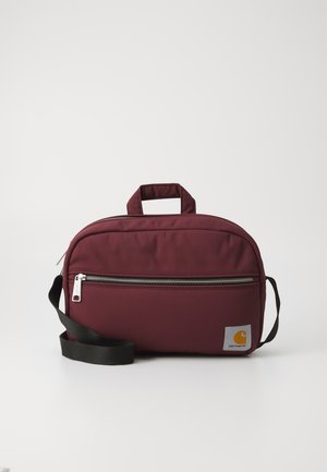Maroon fabric bag with a top handle and adjustable black strap. Features a silver zipper and a gray logo patch with an orange emblem.