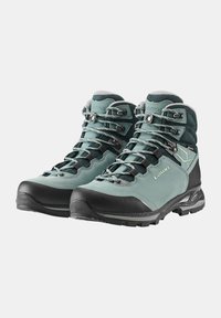 Buty trekkingowe w kolorze turkusowym i czarnym, wykonane ze skóry, z metalowymi hakami i wzmocnionym noskiem, z wyściełanym kołnierzem i podeszwą o dobrej przyczepności.