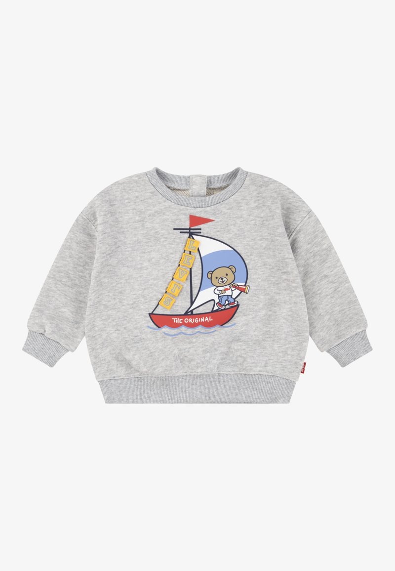 Sweatshirt gris pour tout-petit avec un ours naviguant sur un bateau rouge et blanc portant l'inscription « The Original » et des blocs jaunes « Levi's » sur la voile.