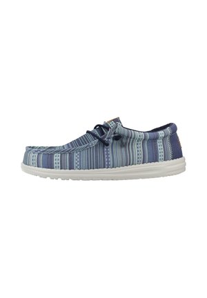 Blue patterned casual slip-on shoe with white sole and black laces, viewed from the side on a white background.