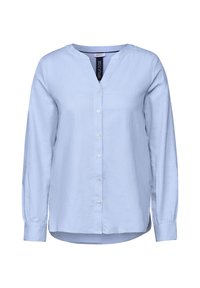 Camicia a maniche lunghe azzurro chiaro con scollo a V, chiusura con bottoni e orlo arrotondato. Realizzata in un tessuto morbido con una trama uniforme e un leggero lucido.