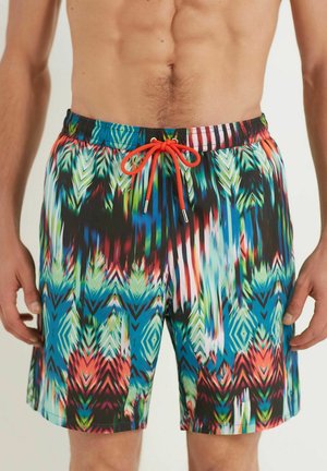 Shorts de bain pour hommes avec un motif géométrique multicolore vif. Fabriqués en tissu léger avec une taille élastique et un cordon de serrage ajustable.