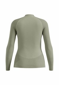 Haut à manches longues en vert doux, présentant un design à côtes texturé, une coupe slim, un col rond et une construction sans couture pour le confort.