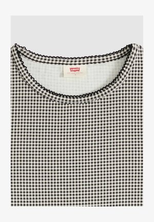 Zwart-wit geruit top met ronde hals, zwarte gegolfde rand en een Levi's-label aan de binnenkant van de halslijn.