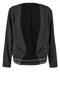 Cardigan noir ouvert devant, manches longues avec un détail de passepoil blanc sur l'ourlet, en tissu doux.