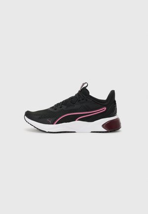 Black athletic sneakers with a mesh upper, pink accents, white midsole, and rubber outsole. Features a secure lace-up design and padded collar.
