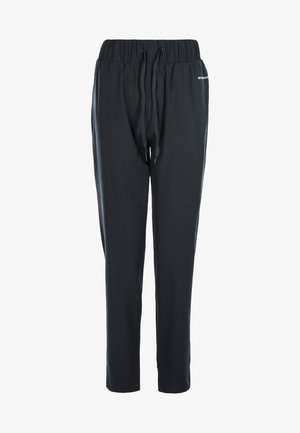 Sorte atletiske bukser med elastisk talje og snor, tætsiddende ben og en glat tekstur. Har et lille logo på siden.