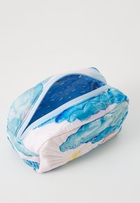 Quilted cosmetic bag with a blue and pink watercolor cloud design, featuring a light blue zipper and a patterned interior with small clouds.