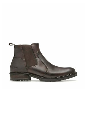 Bottine Chelsea en cuir brun foncé avec panneaux latéraux élastiques, petit talon empilé, détail de couture et languette au talon.